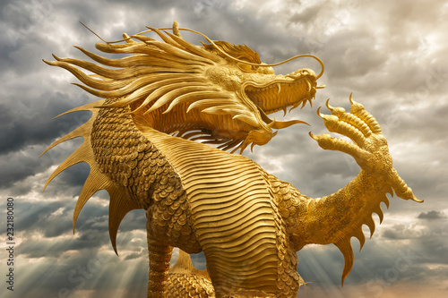 Golden Chinese dragon with sunset