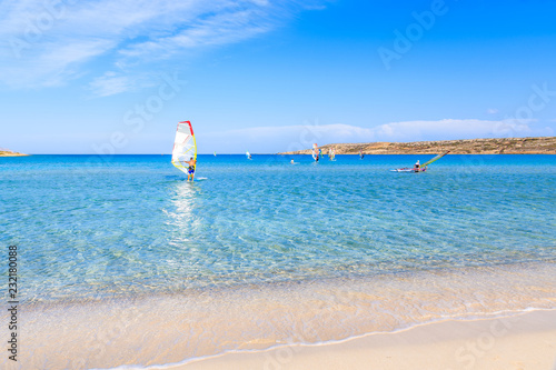 Fototapeta Naklejka Na Ścianę i Meble -  Windsurfer on sea in beautiful bay with beach, Karpathos island, Greece