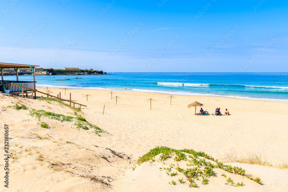 Unidentified people sunbathing on beach in Tarifa town, Spain Unidentified people sunbathing on beach in Tarifa town, Spain