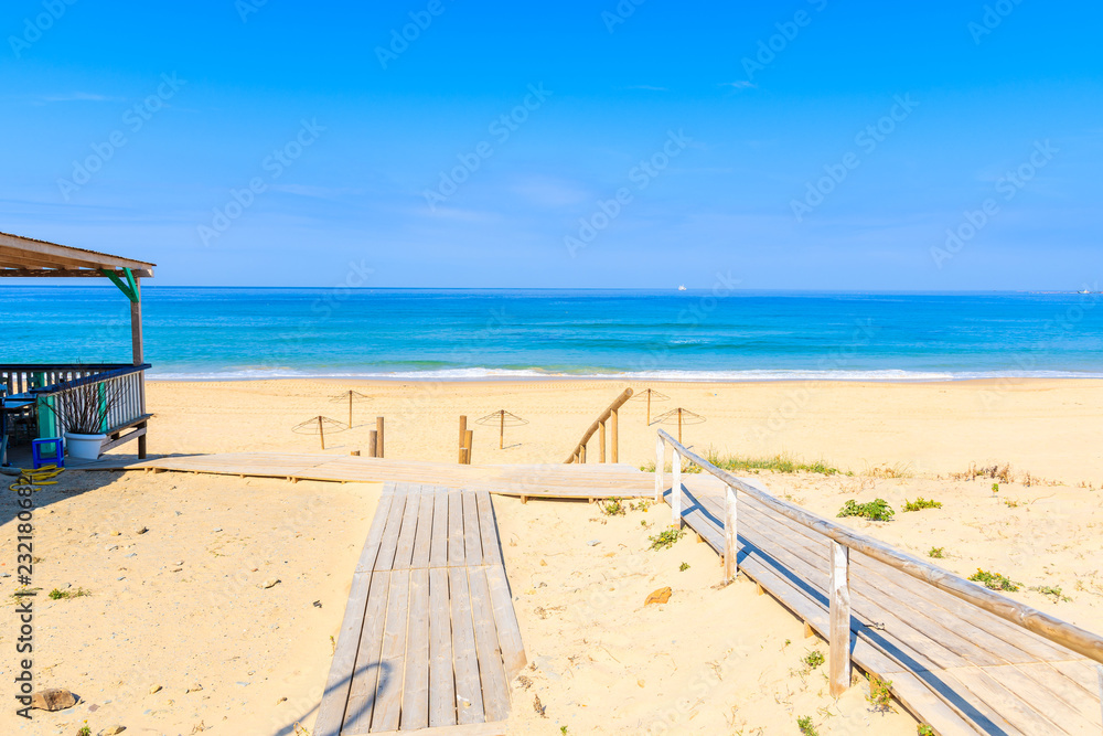Wooden walkway from sand dunes to beach in Tarifa town, Spain