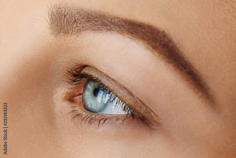 Femal face with blue eye without make-up Femal face with blue eye without make-up
