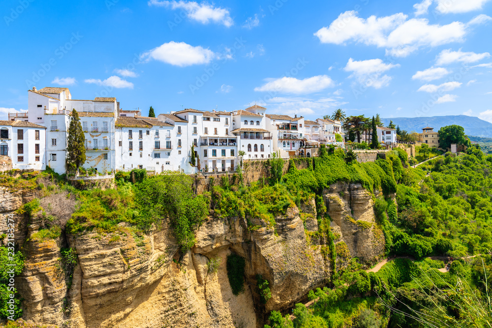White houses on green hills in Ronda village in spring, Andalusia, Spain