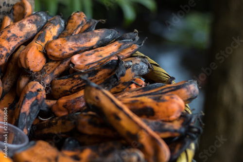 Calabaza y plátanos a la venta