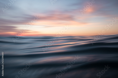 Low angle view of sunset over ocean waves