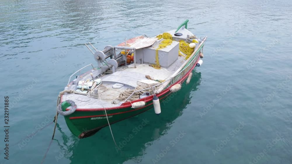 Fishing boat stands on the pier in clear water. Fishing boat. 4K Fishing boat stands on the pier in clear water. Fishing boat. 4K
