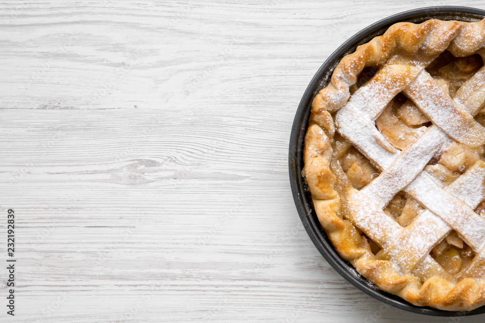 Homemade apple pie on white wooden table, top view. Flat lay, overhead, from above. Copy space. Homemade apple pie on white wooden table, top view. Flat lay, overhead, from above. Copy space.