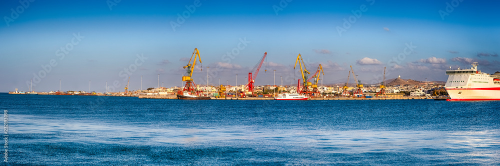 Panorama of Old Venetian Harbour, Port with Cranes and Lines of Cruise Ships in Heraklion City on Crete Island, Greece.