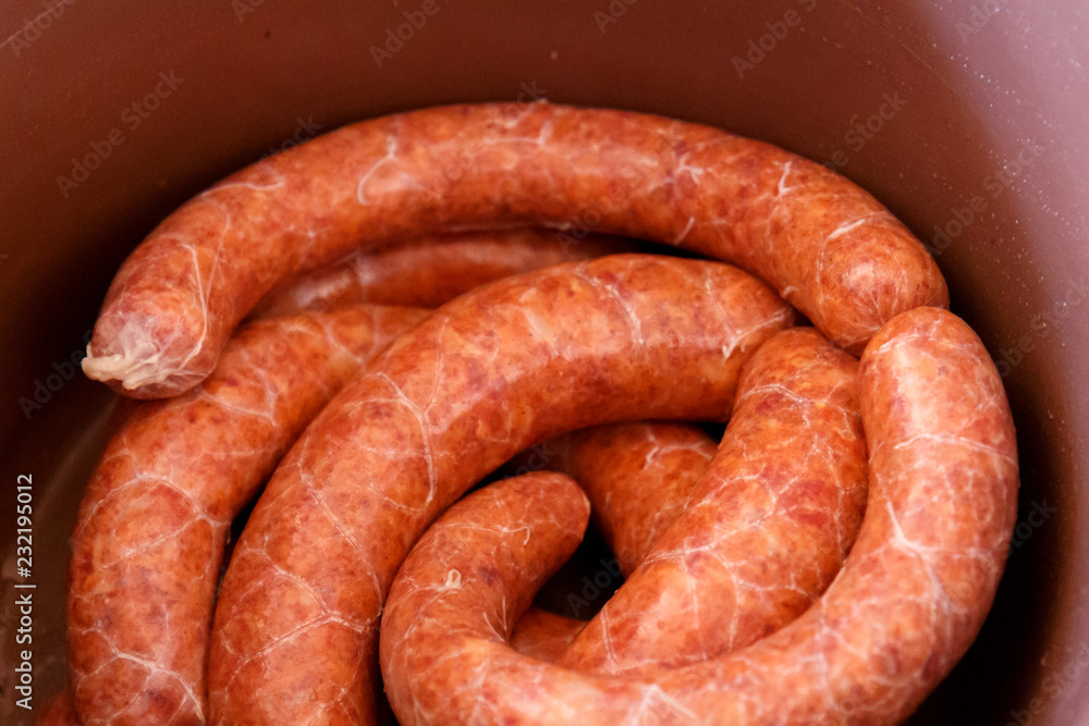 Fototapeta premium Raw homemade sausage with paprika before fumigation