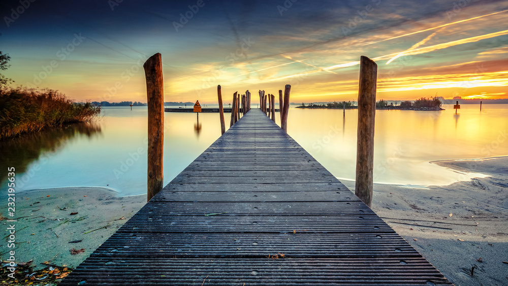 Architecture built walkway on the water with perspective, view art and calm water at sunny sunset