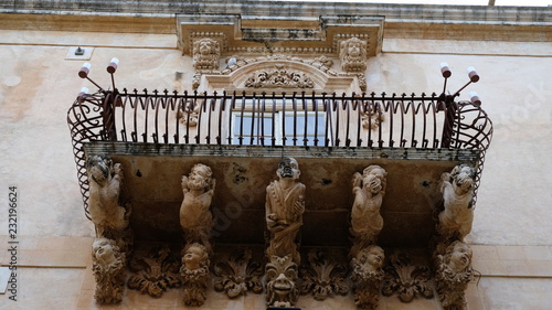 City of Noto. Province of Syracuse, Sicily. One of the spectacular balconies of the Palazzo Nicolaci. The city of Noto is known as one of the most remarcable examples of the sicilian baroque style. photo