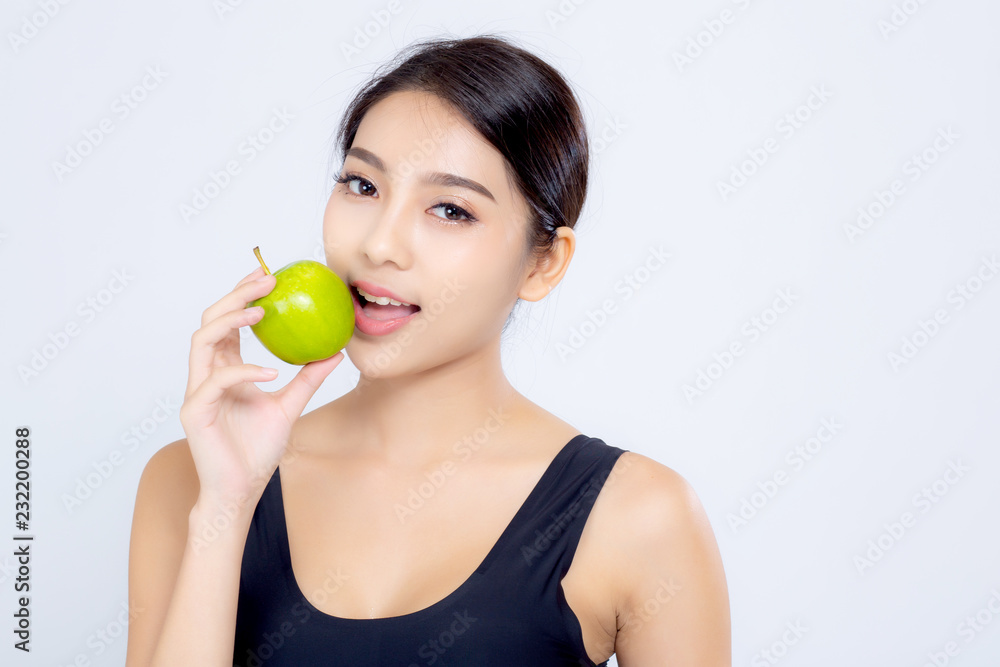 Portrait asian woman smiling eating green apple fruit and beautiful body diet with fit isolated on white background, girl weight slim with cellulite or calories, health and wellness concept. Portrait asian woman smiling eating green apple fruit and beautiful body diet with fit isolated on white background, girl weight slim with cellulite or calories, health and wellness concept.