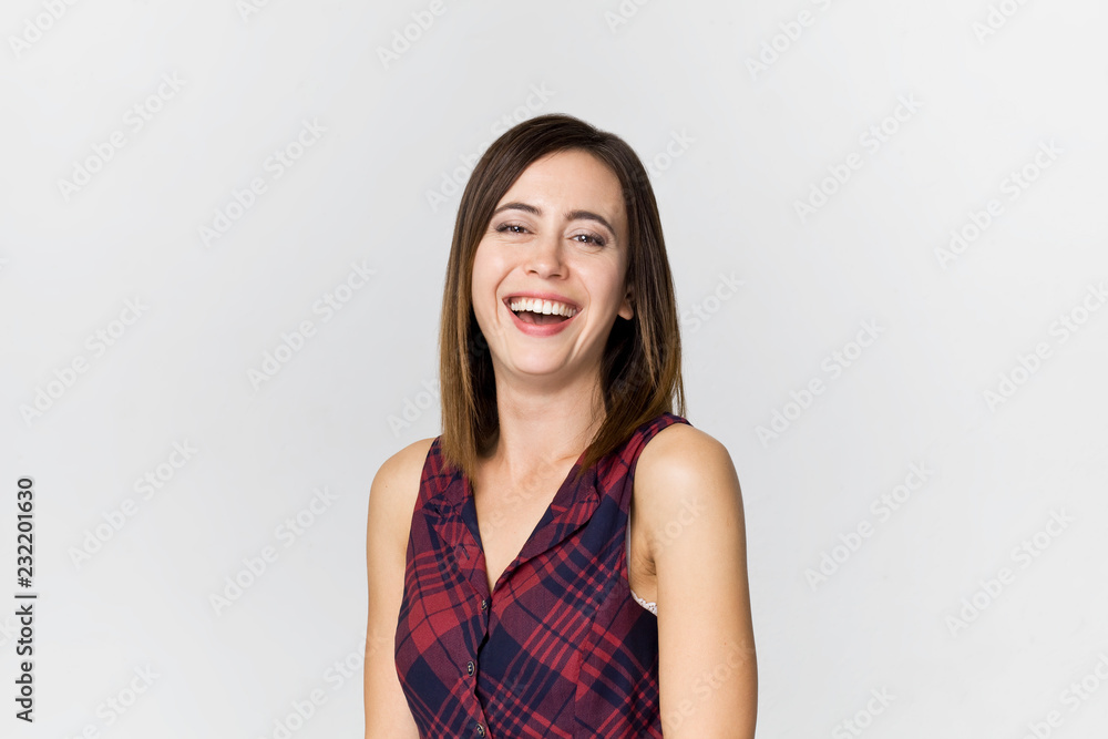Amazing and cheerful smiling brunette woman in beautiful dress studio shot, isolated on white Amazing and cheerful smiling brunette woman in beautiful dress studio shot, isolated on white