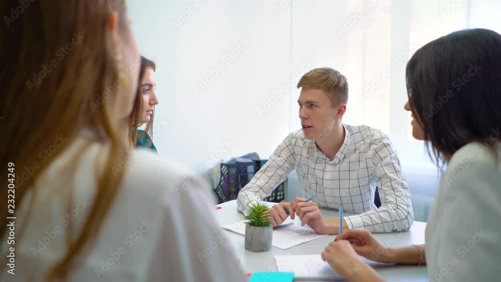 college male and female students having teamwork practice at table. interactivity education, practice, learning, knowledge, cooperation, study concept college male and female students having teamwork practice at table. interactivity education, practice, learning, knowledge, cooperation, study concept