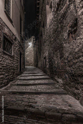 Medieval street that goes up narrow towards Bergamo Alta in the night