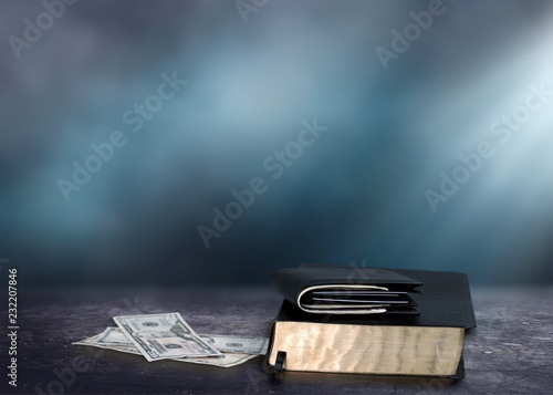 Photography Holy Bible and money with Black wallet