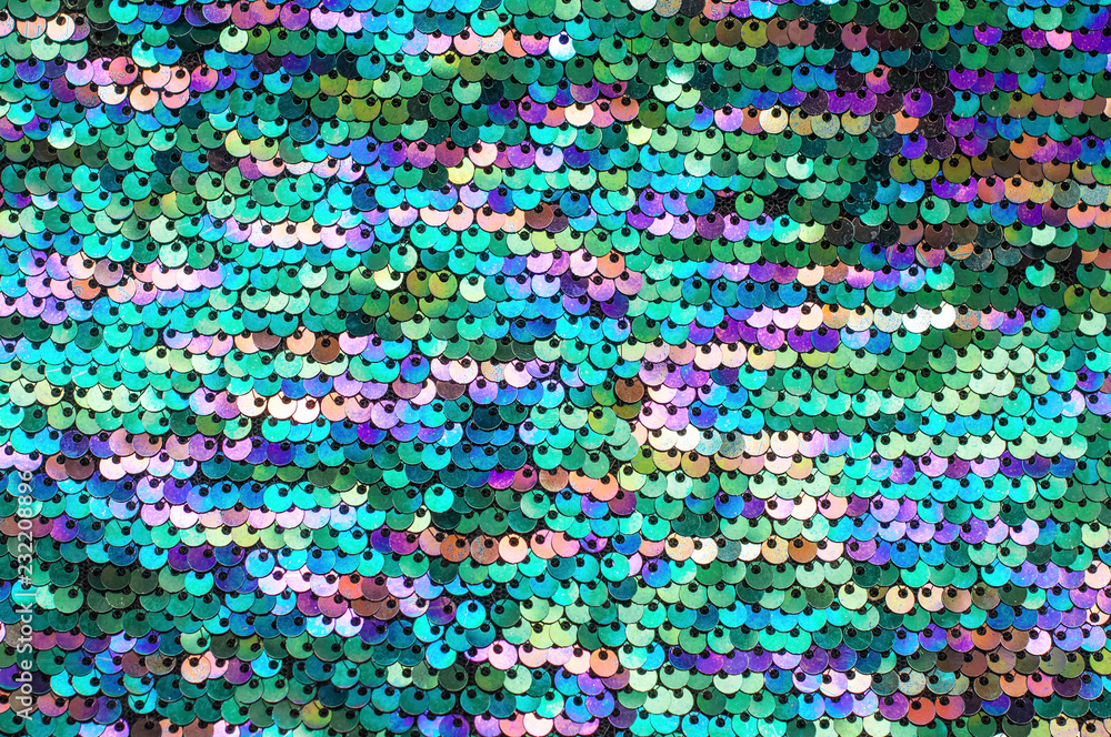 Bright shiny ornaments in round flat shape as background.