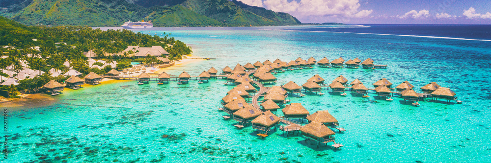 Travel vacation Tahiti hotel ocean beach paradise of overwater bungalows resort in coral reef lagoon ocean. View from above at sunset of Moorea, French Polynesia, Tahiti, South Pacific Ocean. - obrazy, fototapety, plakaty 