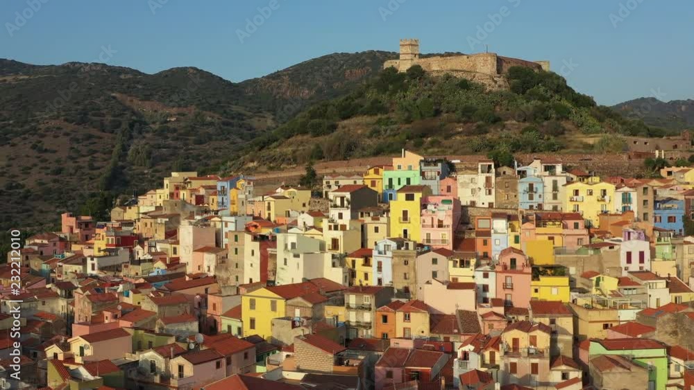 Aerial view of the beautiful village of Bosa with colored houses and a medieval castle. Bosa is located in the north-wesh of Sardinia, Italy..mov Aerial view of the beautiful village of Bosa with colored houses and a medieval castle. Bosa is located in the north-wesh of Sardinia, Italy..mov