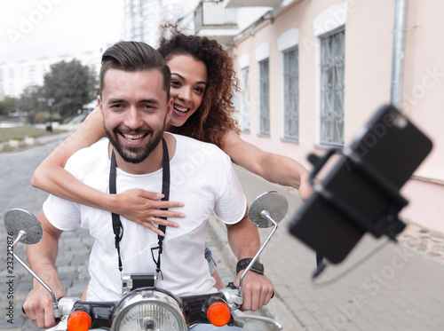 Happy couple traveling on motorcycle.Travel concept