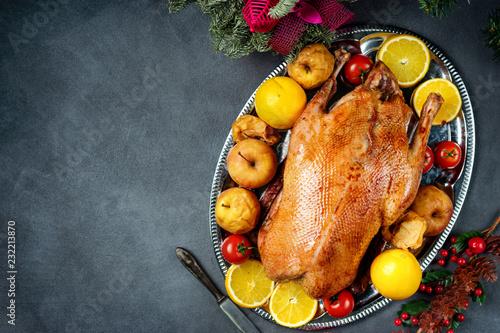 Christmas roasted whole goose on rustic table photo