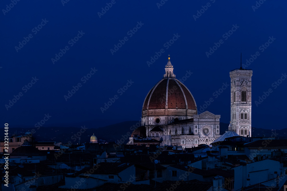 Cityscape, skyline aerial view of Firenze, Italy, Italian city at dark night, twilight, dusk, houses, buildings roofs, rooftops, illuminated Florence Cathedral, Cattedrale di Santa Maria del Fiore