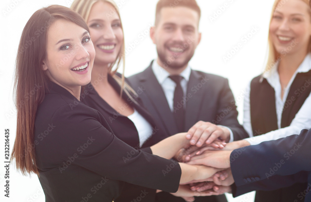 closeup.smiling business team with hands clasped together closeup.smiling business team with hands clasped together