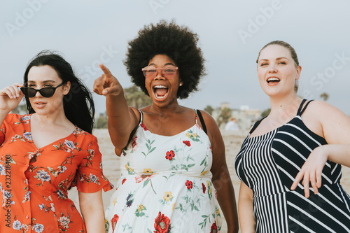 Cheerful diverse plus size women at the beach photo