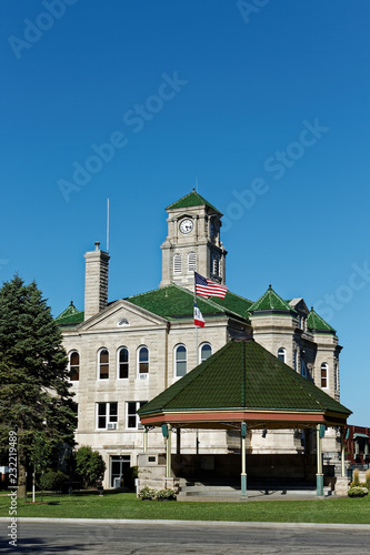 The Appanoose County Courthouse rises above the matching gazebo. This courthouse has served the county since 1904. photo