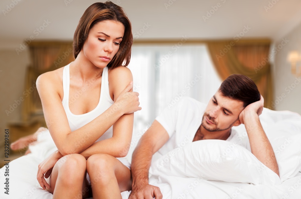 Dissatisfied beautiful young woman in bed with Dissatisfied beautiful young woman in bed with