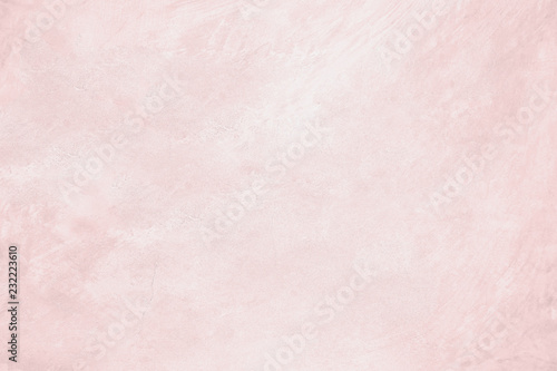 Pink pastel cement texture plastered stucco wall white painted fade background.