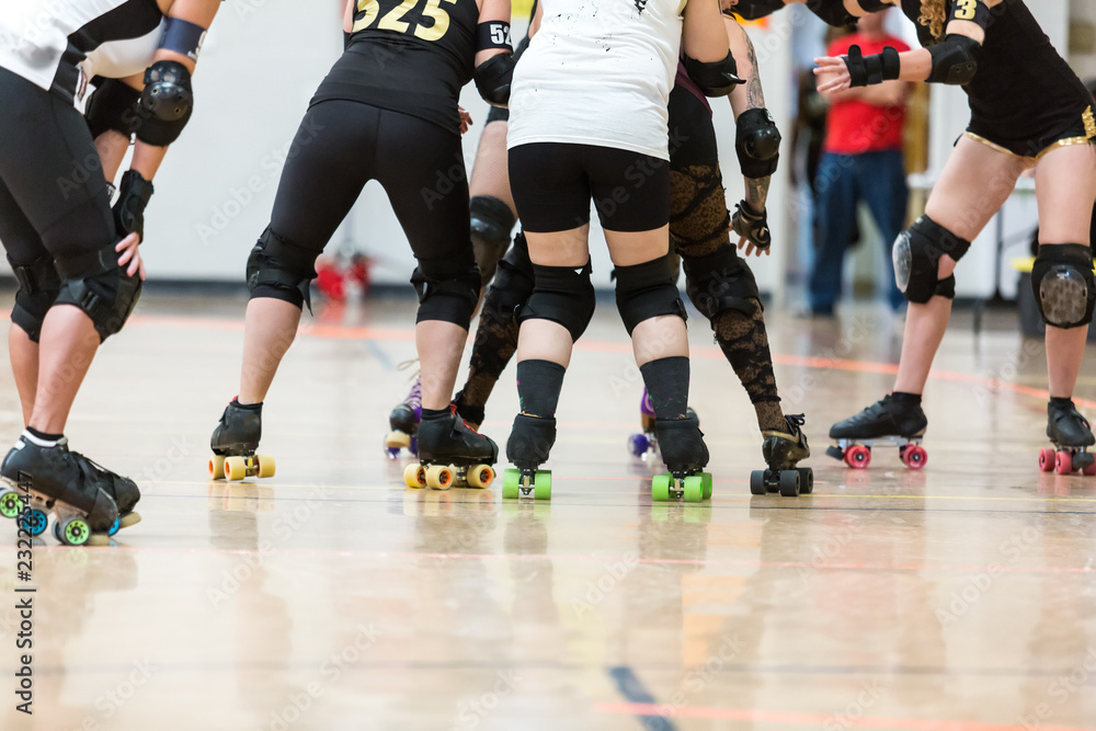 Roller derby players compete against each other
