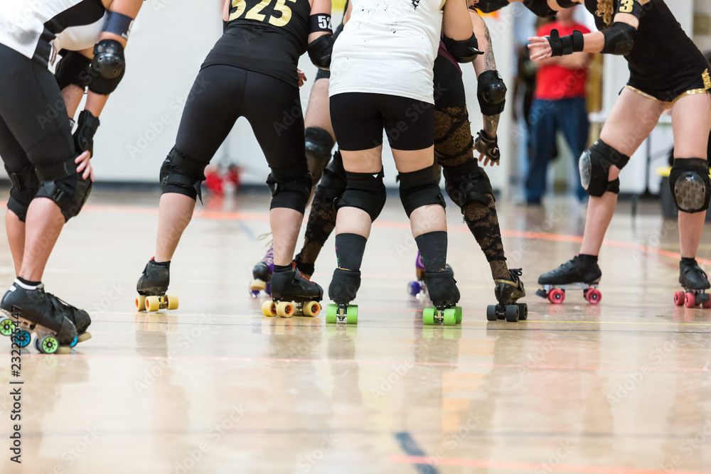 Roller derby players compete against each other Roller derby players compete against each other