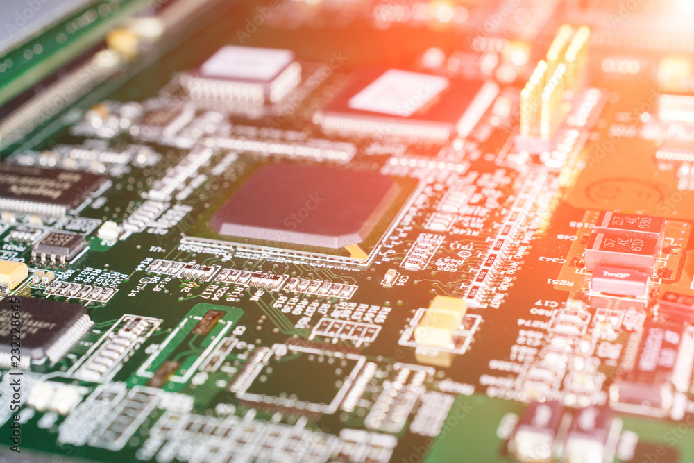 Printed Circuit board from a computer in black with green lines Printed Circuit board from a computer in black with green lines