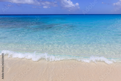 Ocean coast with white sandy coast and turquoise colorful waters