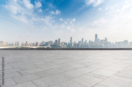 Panoramic skyline and modern business office buildings with empty road empty concrete square floor