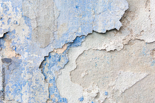 Old weathered blue plaster wall texture. Grunge background.