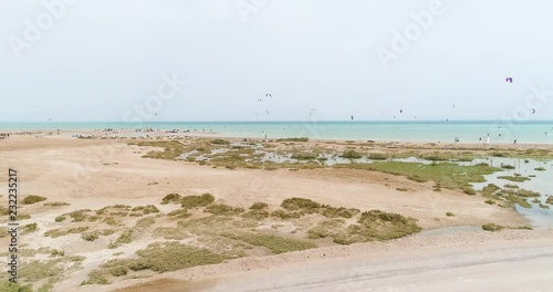 Aerial, parasailors off coastline photo