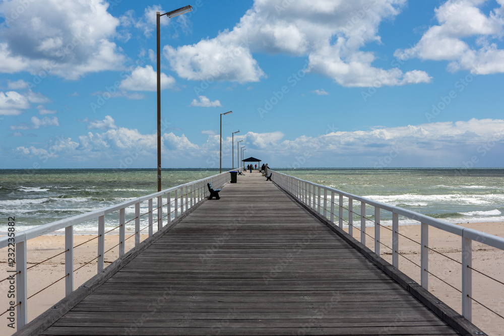 The grange jetty with a blue sky and white fluffy clouds at Grange South Australia on 7th November 2018