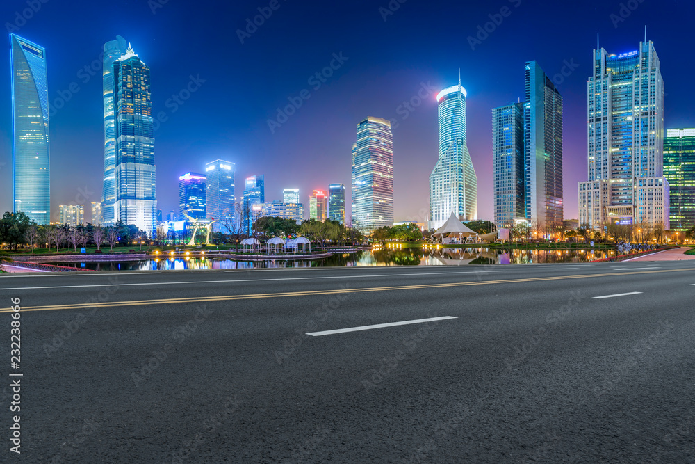 Fototapeta premium Empty asphalt road along modern commercial buildings in China's cities