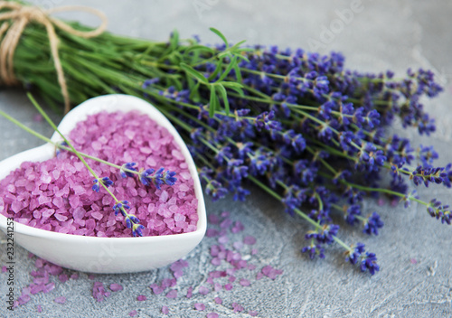 Heart-shaped bowl with sea salt and fresh lavender flowers