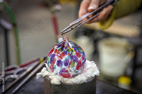 A Beautiful Glass Ball Being Made by a Glass Blower