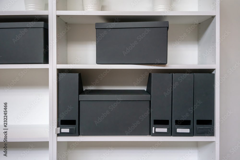 Empty paper filing box and file holder on shelf. Empty paper filing box and file holder on shelf.