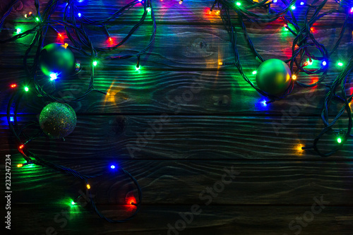 glowing christmas garland on wooden background