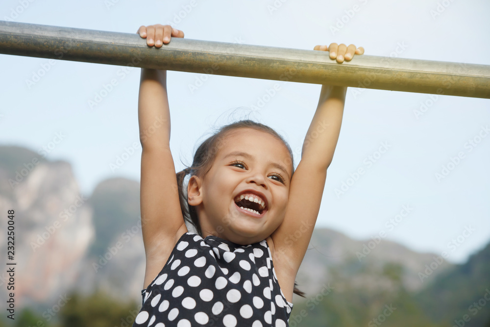 Little girl smiling and relaxing. Little girl smiling and relaxing.