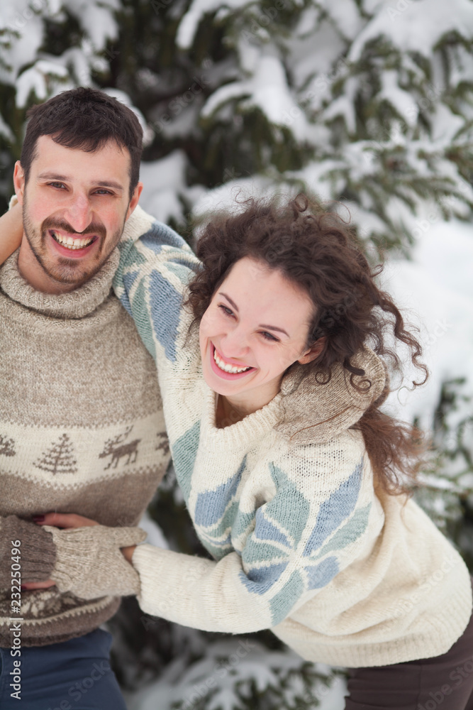 Happy young couple having fun and laughing in winter Happy young couple having fun and laughing in winter