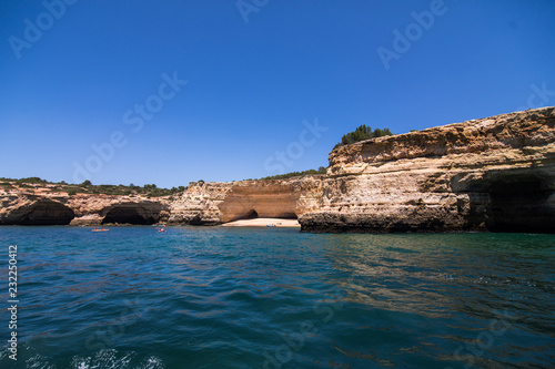 Rocks, cliffs and ocean landscape at coast in AAlgarve, Portugal view from boat