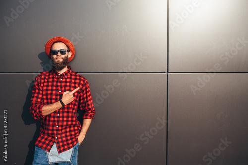 Hipster man pointing with fingers at your text