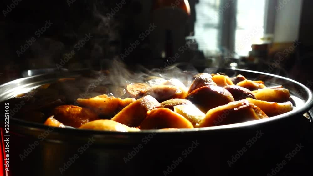Cooking stewed fruit. Slow motion. Compote cooks in a pan. Cooking stewed fruit. Slow motion. Compote cooks in a pan.