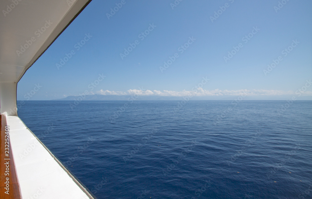 Porthole view over the caribbean sea.