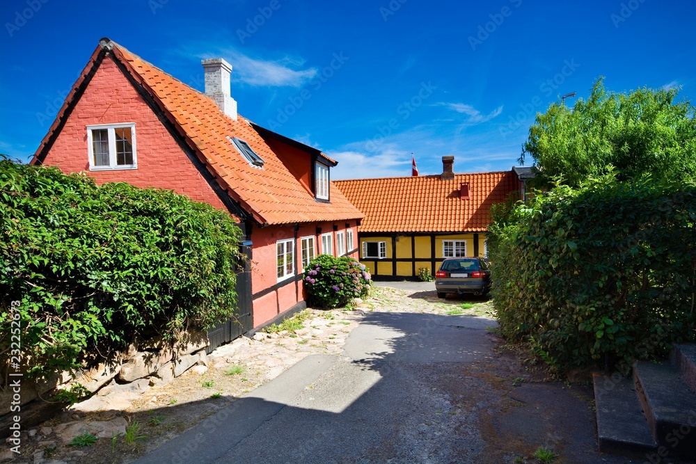 Traditional colorful half-timbered houses in Gudhjem, Bornholm, Denmark